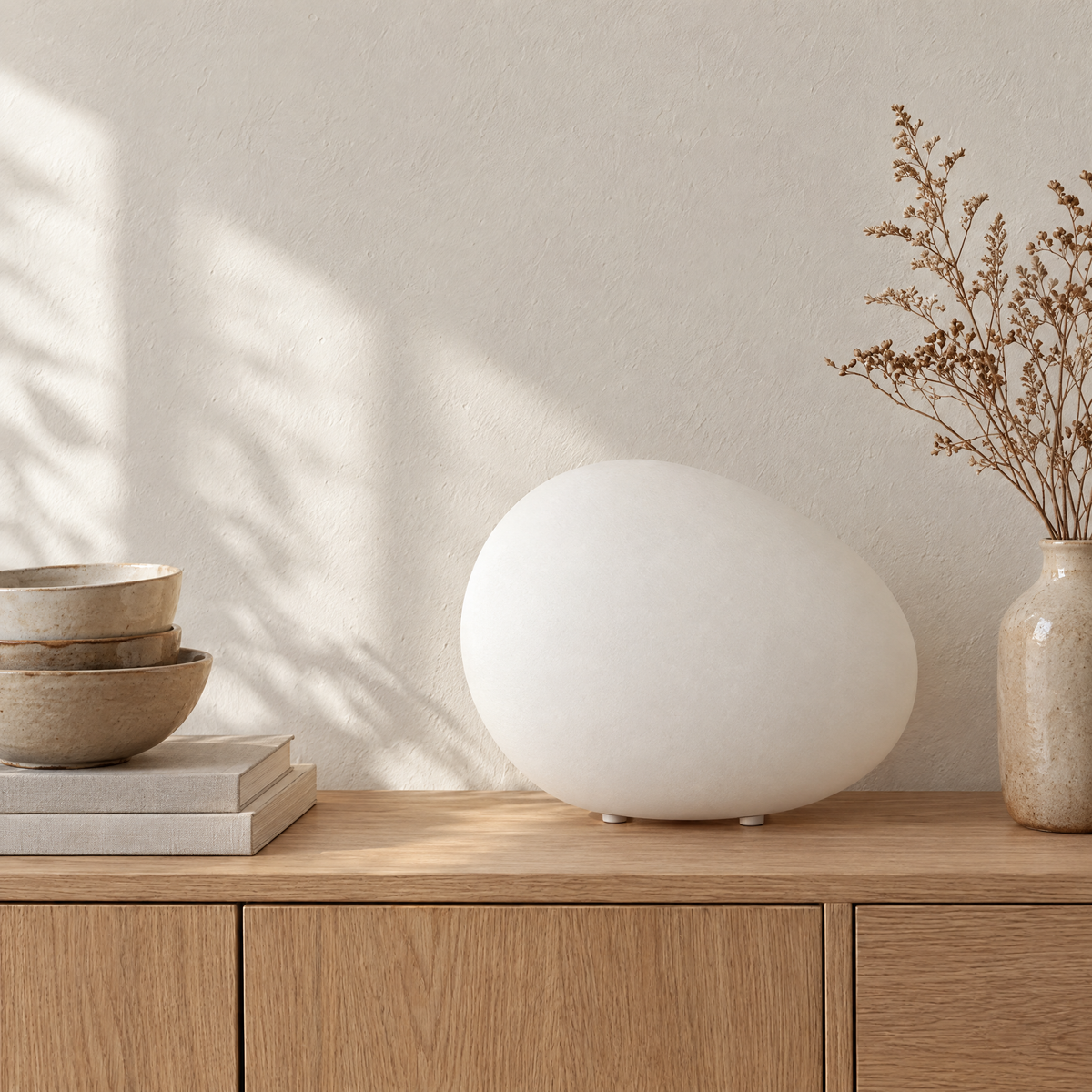 Ciottolo pebble lamp on a styled console