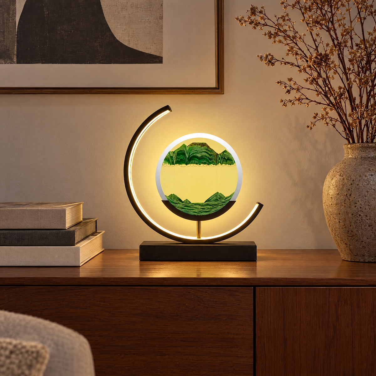 Duna moving sand lamp on a living room sideboard in the evening