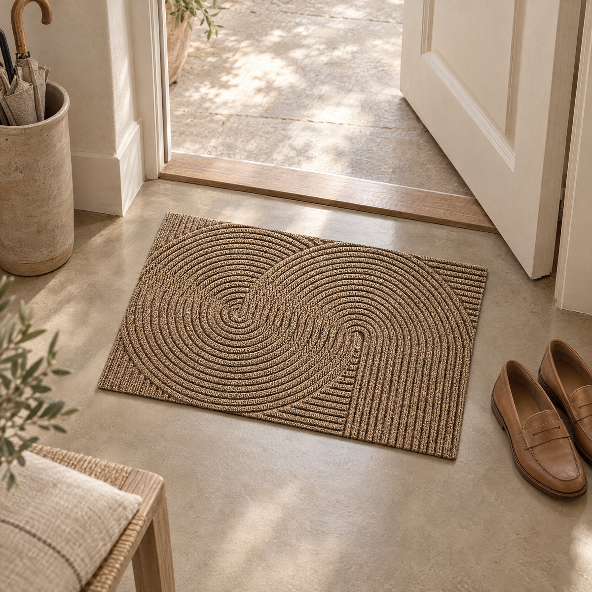 Linnea Non-Slip Door Mat in khaki in a hallway entrance with leather loafers