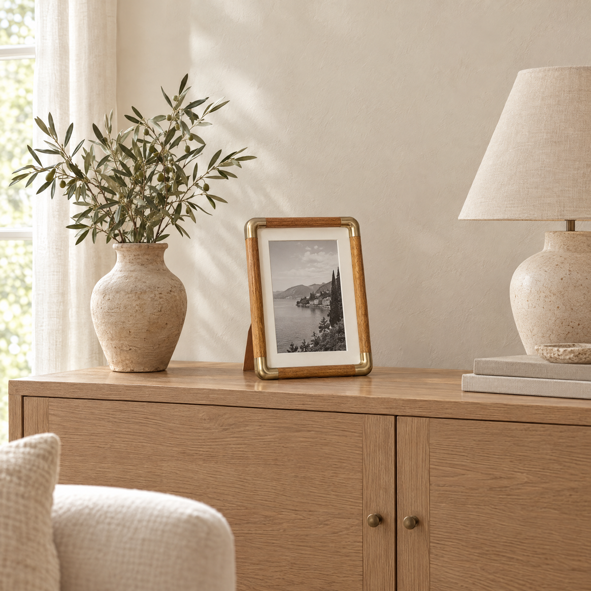 Teak Cornice photo frame on an oak sideboard in a calm living room
