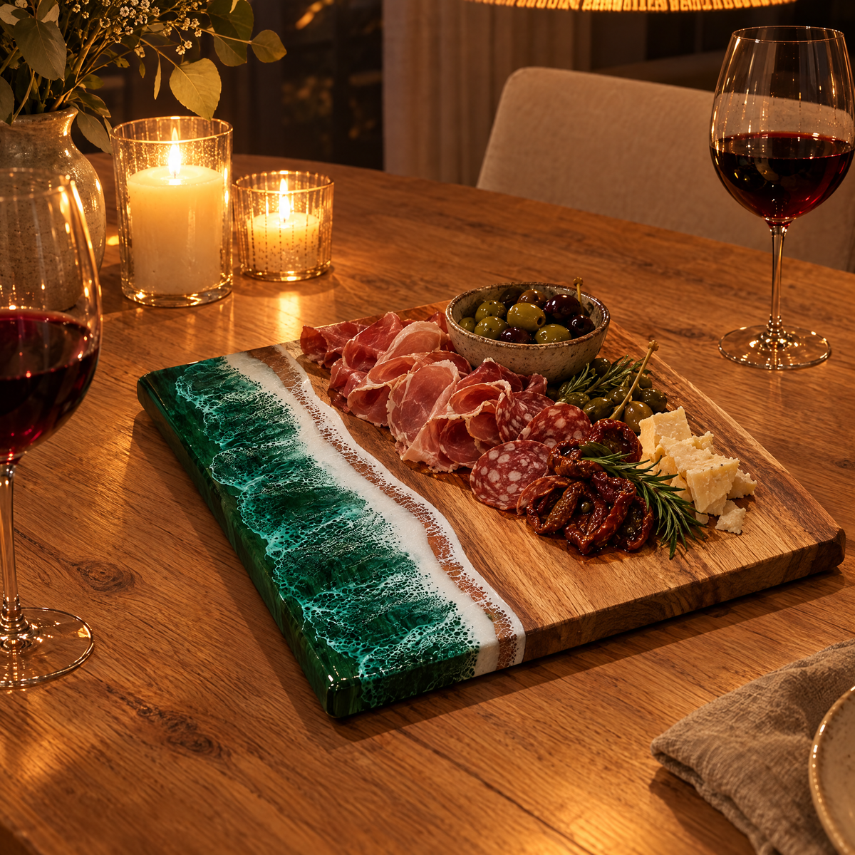 Onda board with cured meats on a candlelit table in the evening
