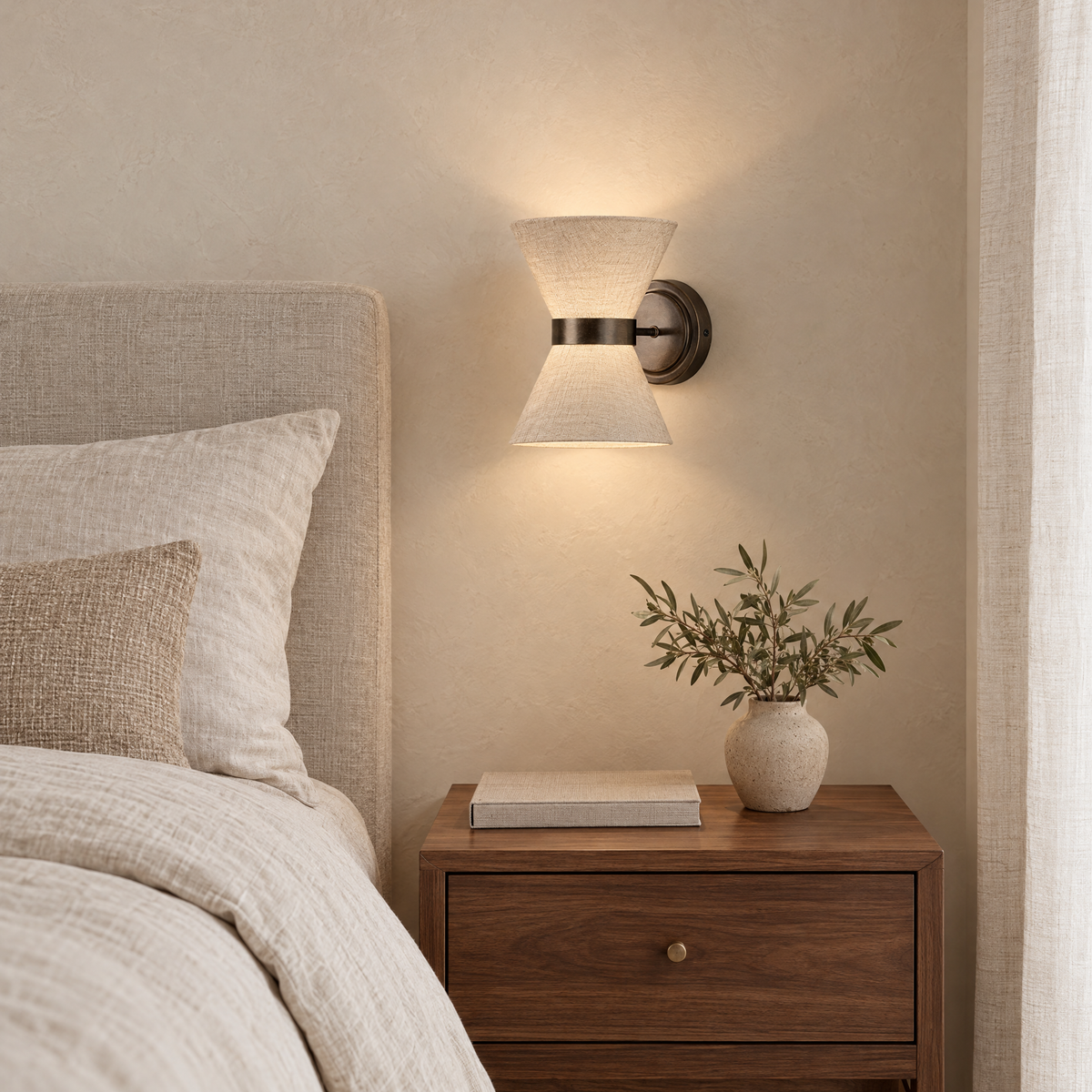 Lino Bronze and Linen Wall Light above a walnut nightstand