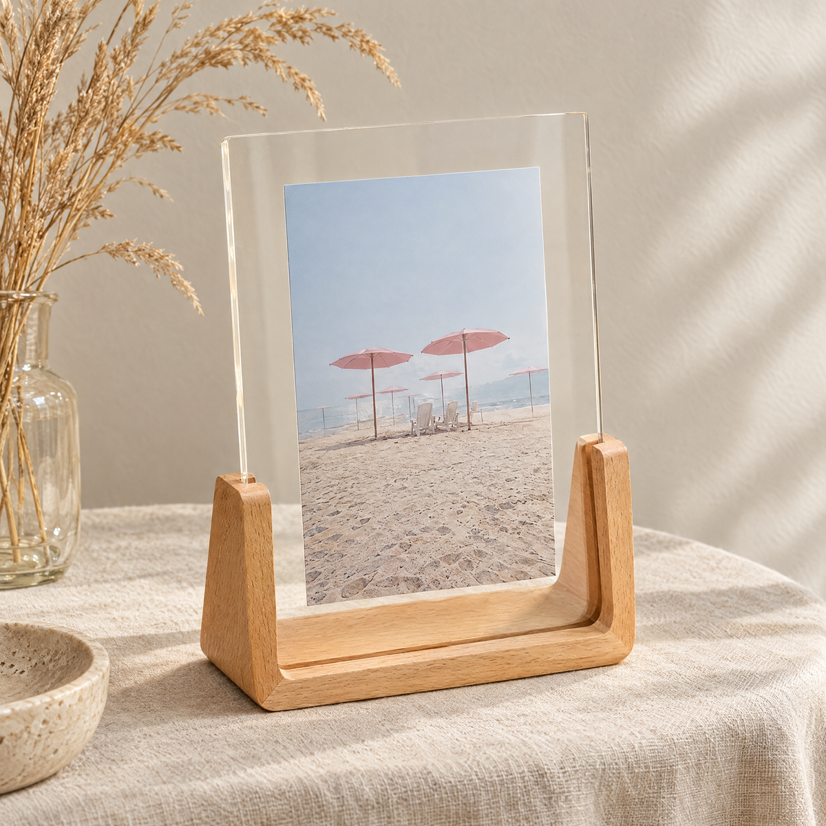 Close-up of the curved wooden base and acrylic of the Chiaro frame