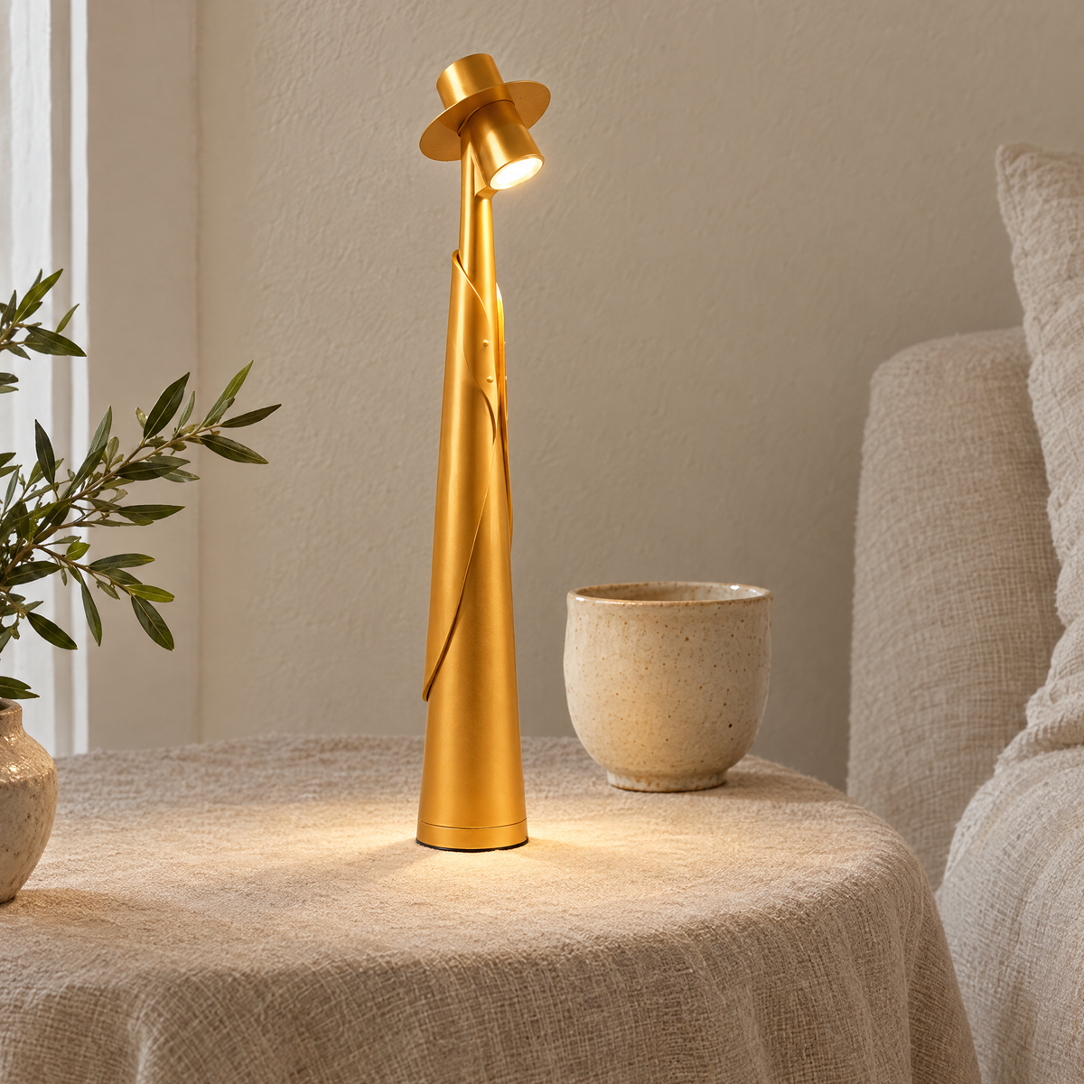 Close-up of the gold Cappello lamp and its brimmed hat