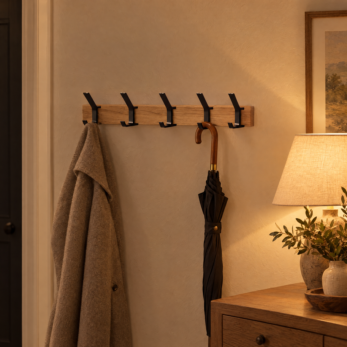 Gancio coat rack in a lamp-lit hallway in the evening