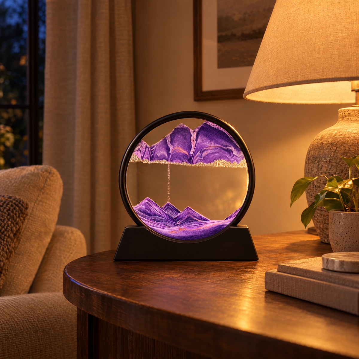 Sabbia Moving Sand Art Frame, purple sand, beside a lamp in the evening