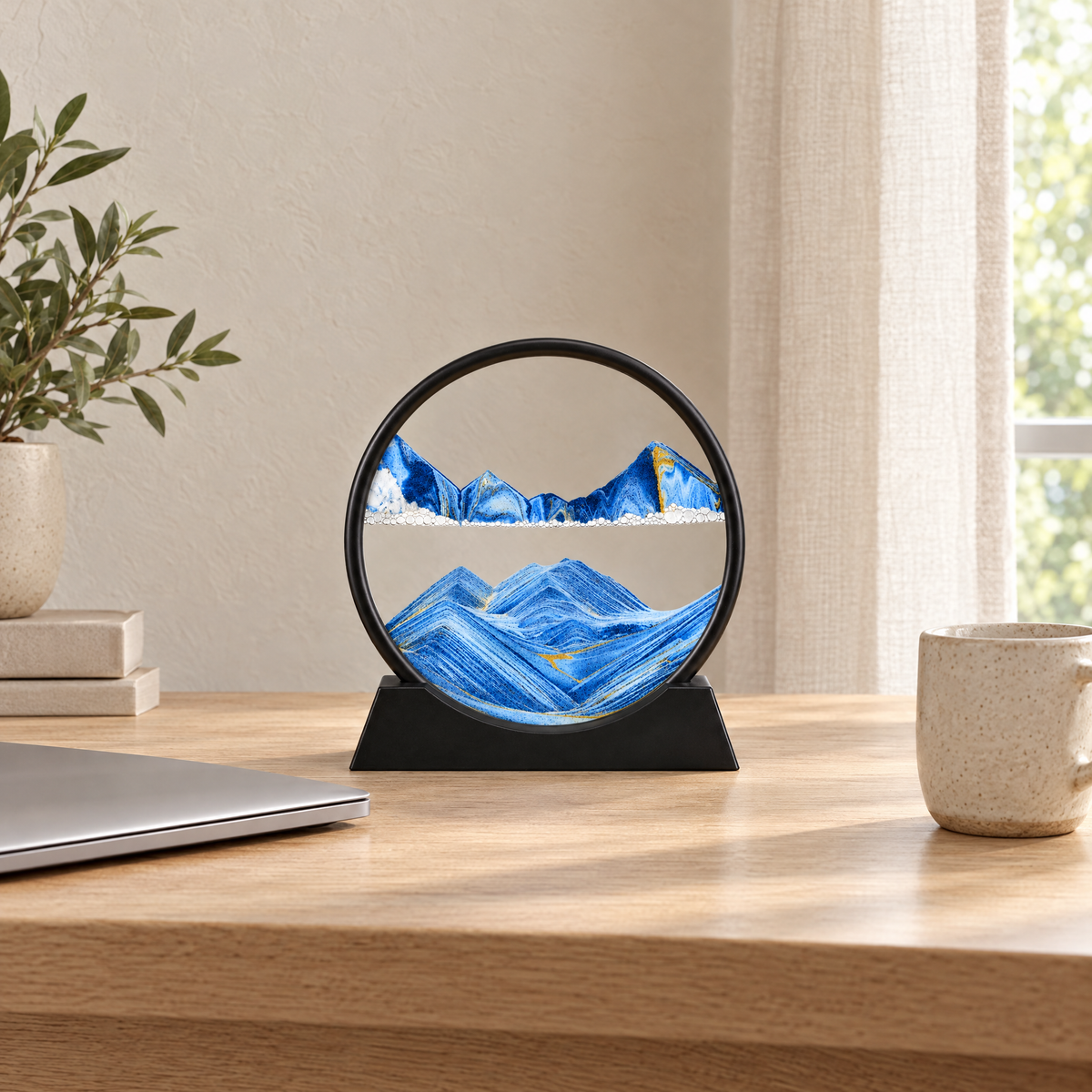Sabbia Moving Sand Art Frame, blue sand, on a home office desk