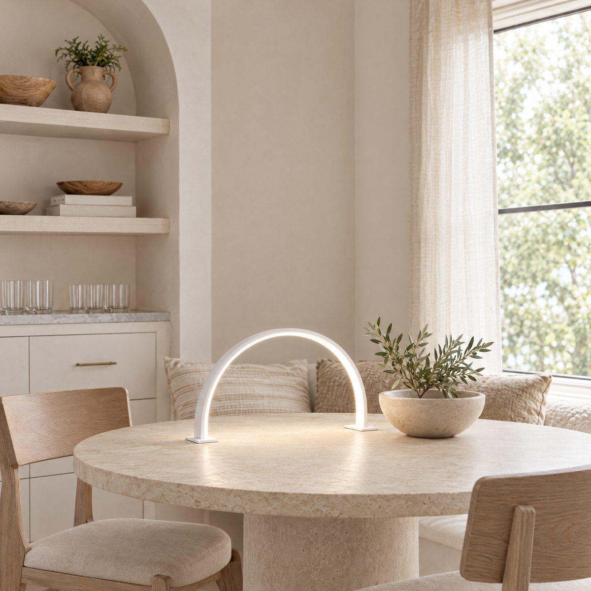 Luna Crescent LED Desk and Nail Lamp in white on a stone dining table