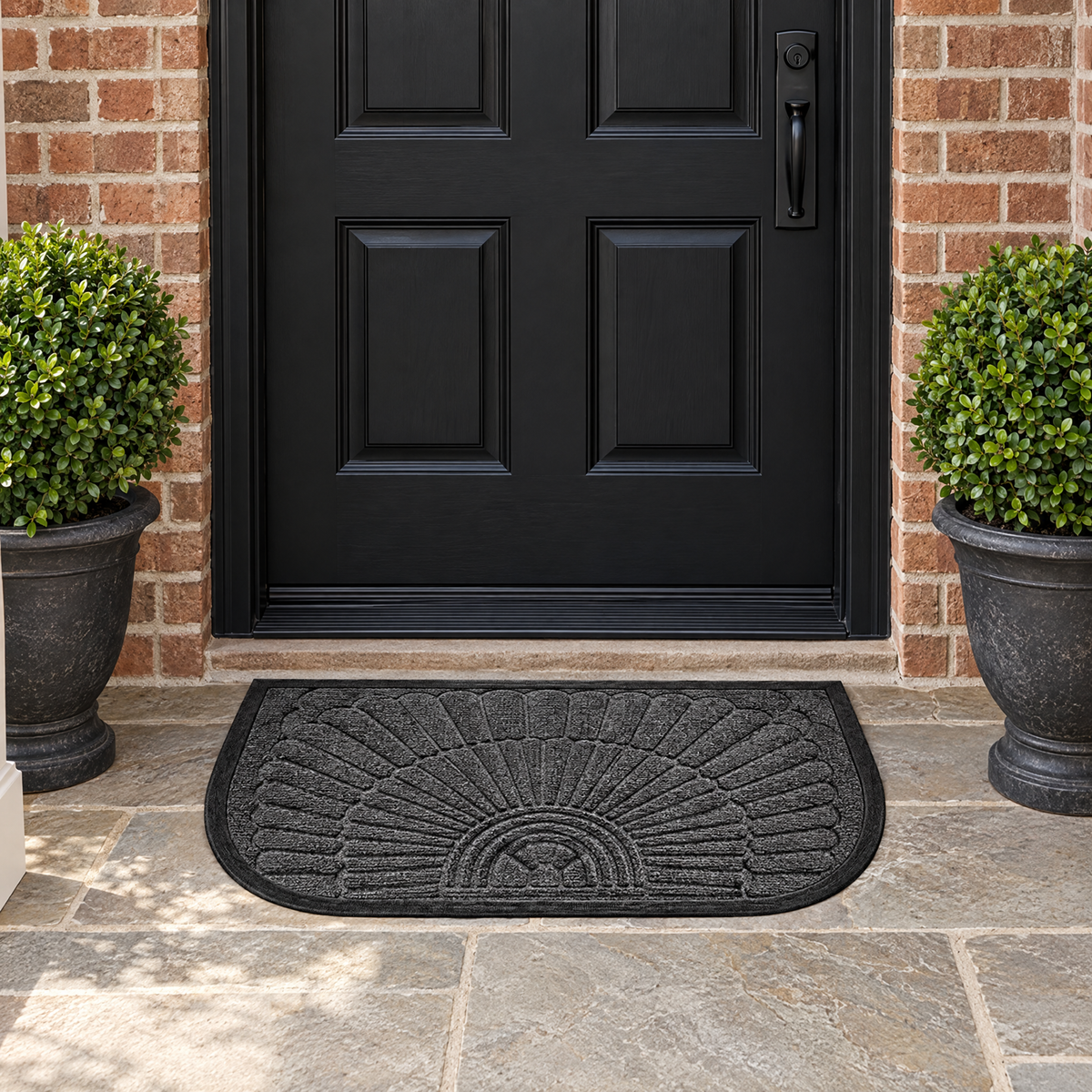 Charcoal Soglia half-round door mat before a black front door on a brick porch