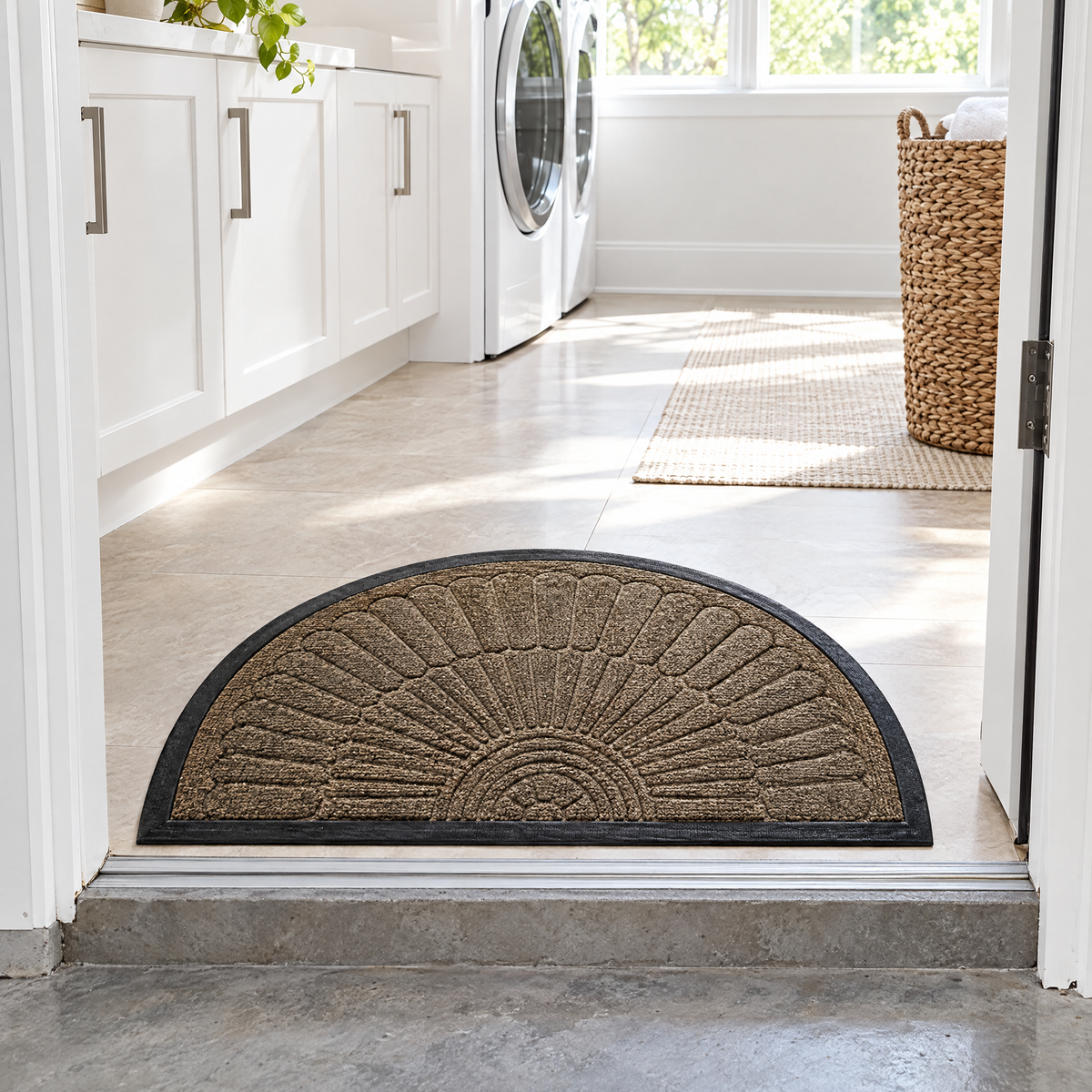 Taupe Soglia door mat at the step from the garage into a laundry room